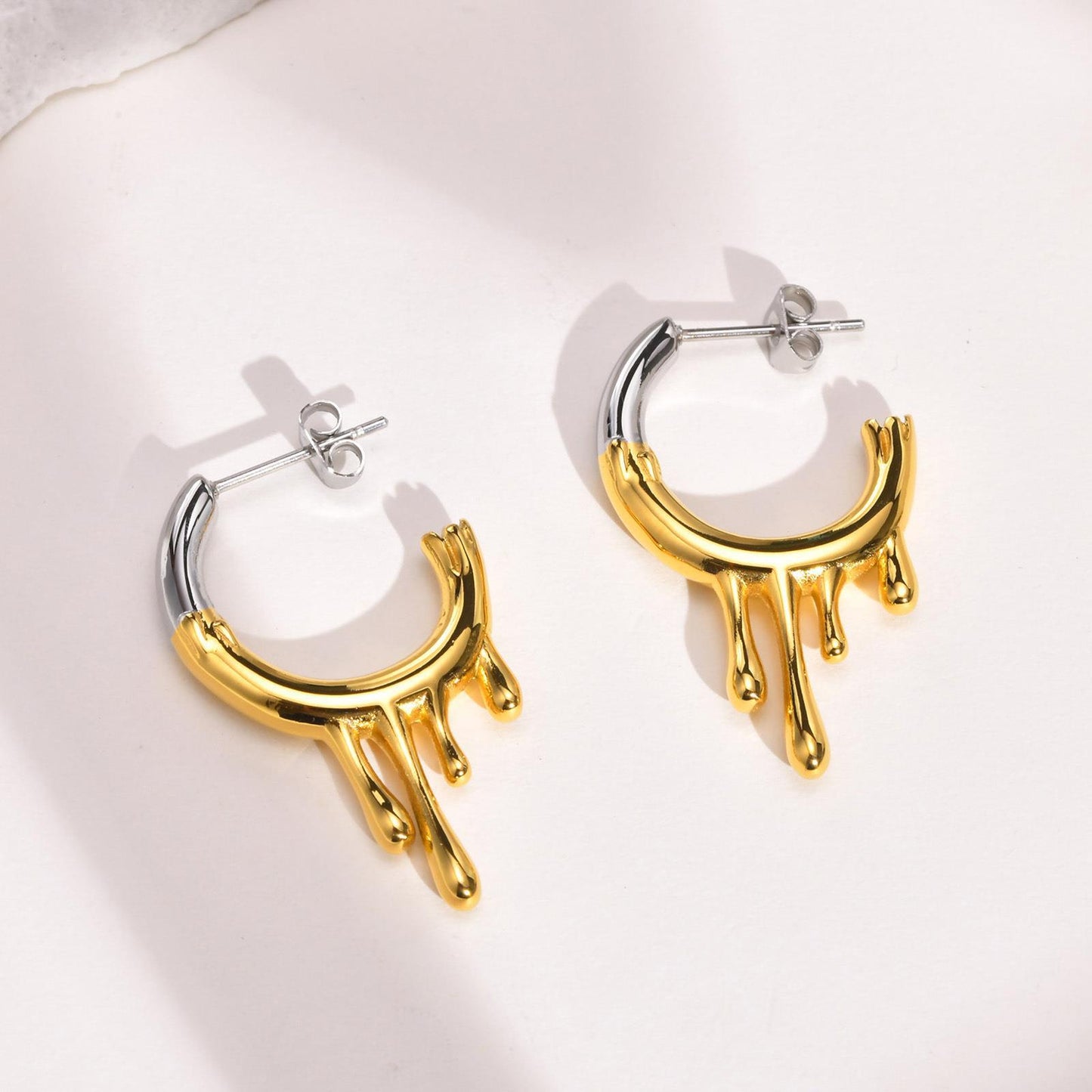 Titanium Steel Irregular Flowing Water Drop C Row Earrings